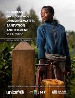 Woman collecting drinking water in South Kivu province in the Democratic Republic of Congo. She is filling a yellow jerry can at a public standpost while staring thoughtfully into the distance. 